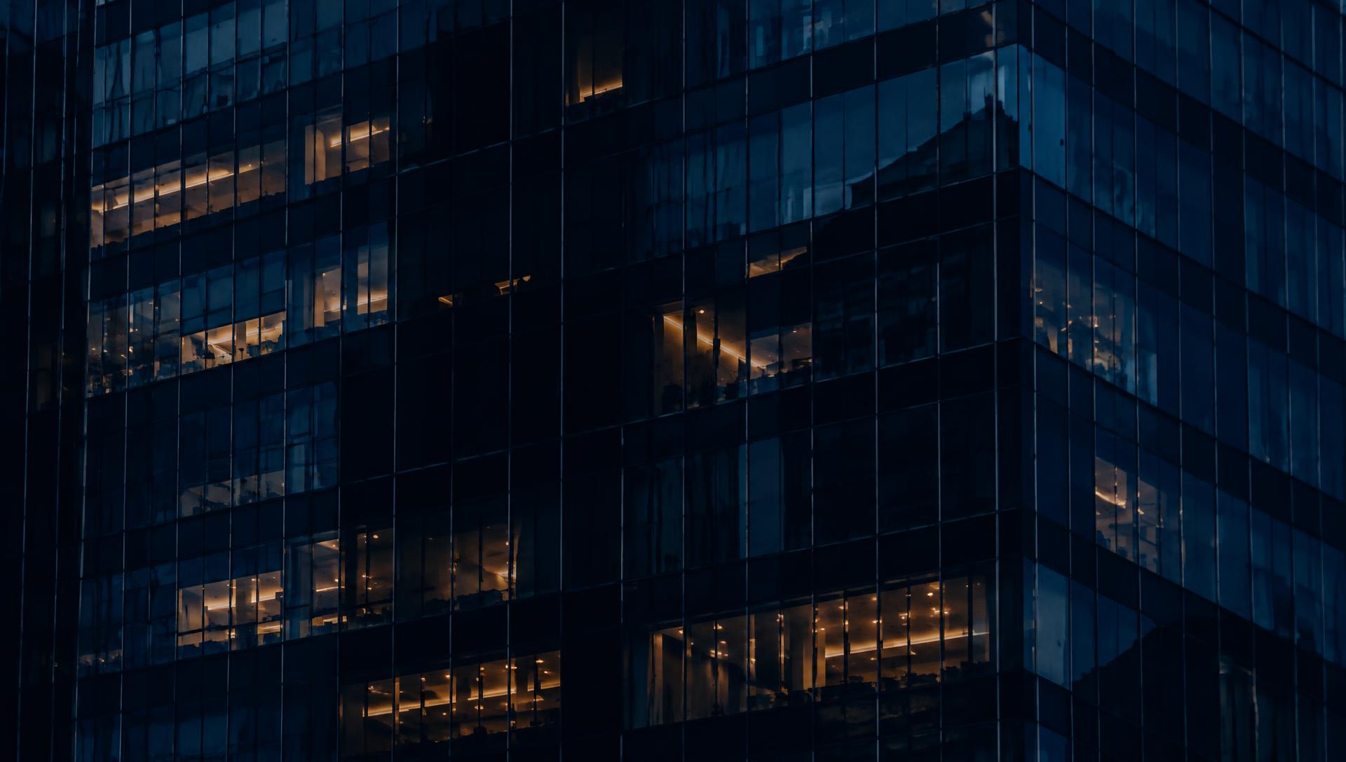 Commercial office tower at night served by Handyman Network Services